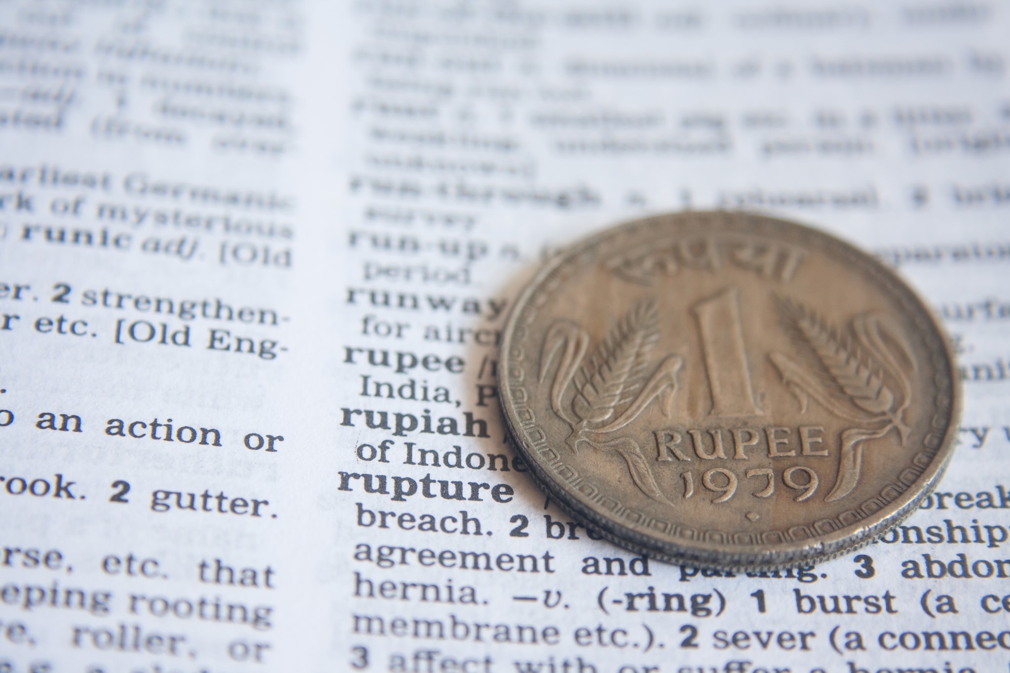 Rupee slumps 23 paise, settles below 74/USD level