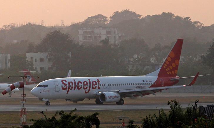 A SpiceJet aircraft taxis on the tarmac after landing at Chhatrapati Shivaji international airport in Mumbai