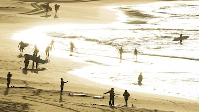 People surf as Bondi Beach reopens to surfers and swimmers after it was closed to curb the spread of the coronavirus disease (COVID-19), with strict social distancing measures remaining in place, in Sydney, Australia, April 28, 2020. REUTERS/Loren Elliott