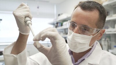 In this image from video provided by Washington University, researcher Nicolas Barthelemy works on a p-tau217 test for Alzheimer's disease at a laboratory in St. Louis, Mo., on Monday, July 27, 2020. Several companies and universities have developed versions of these tests, which look for a form of tau protein, one of the substances that can build up and damage the brains of people with Alzheimer’s. (Huy Mach/Washington University, St. Louis via AP)