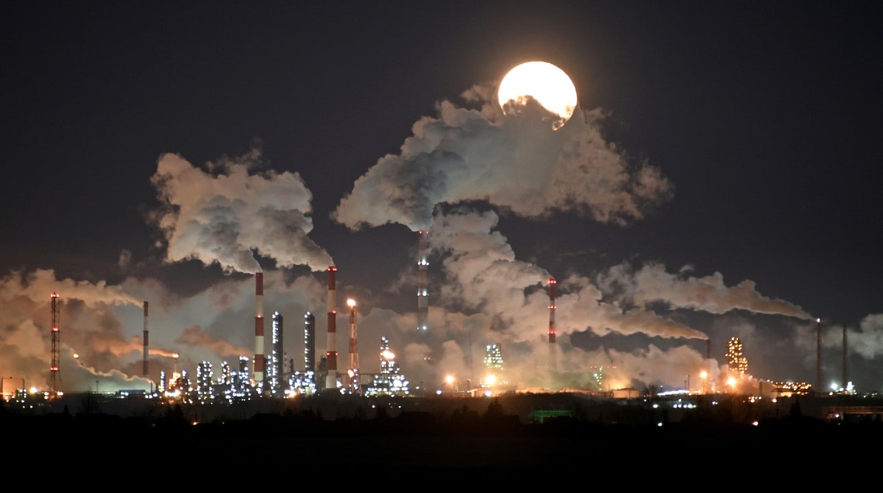 Full moon rises over the Gazprom Neft's oil refinery in Omsk, Russia