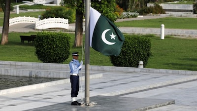 FILE: A member of the Pakistan Air Force (PAF) rehearses flag masting at the mausoleum of Muhammad Ali Jinnah before the Defence Day ceremonies, or Pakistan's Memorial Day, in Karachi. (File photo/Reuters)