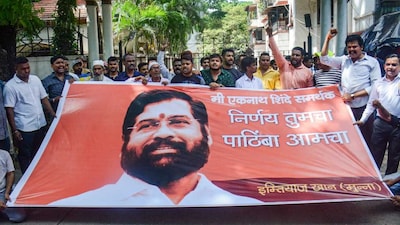 Supporters of Thane MLA Eknath Shinde shout slogans outside his residence. (PTI)