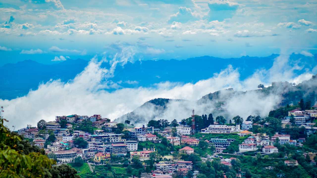 No 6. Mussoorie | located 279 km from Delhi, captivates visitors with its misty mountains, colonial charm, and iconic attractions like the Gun Hill and Kempty Falls, offering a serene hill station experience amidst nature's bounty.