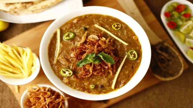 2. Haleem | A Ramadan favourite, Hyderabadi Haleem is a slow-cooked stew made from wheat, lentils, and finely minced meat, often mutton or chicken. It is simmered for hours with spices, ghee, and dry fruits, resulting in a creamy, hearty dish. Served hot with lemon and fried onions, it’s both a comfort food and a festive delicacy.
