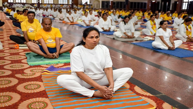 Malasana | Also known as the "garland pose", Malasana is executed by standing with feet slightly wider than hip-width apart. Squat down without bending the spine and bring your hands together in 'namaste'. Malasana | Also known as the "garland pose", Malasana is executed by standing with feet slightly wider than hip-width apart. Squat down without bending the spine and bring your hands together in 'namaste'.