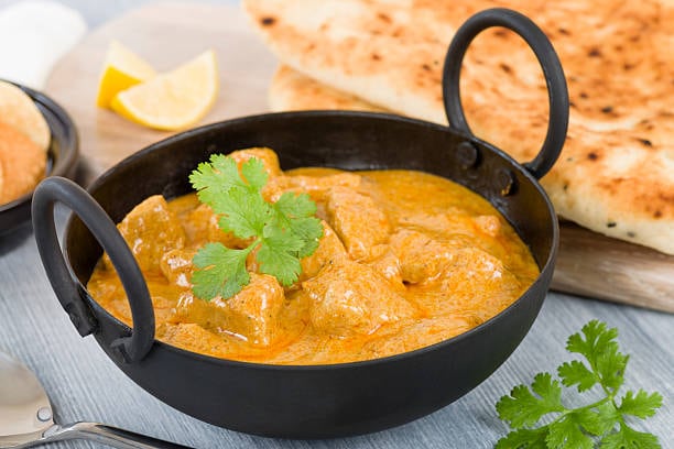 Rank 22. Korma | Known for its velvety texture and indulgent taste, Korma captivates with its luxurious combination of tender meat or vegetables cooked in a rich, nutty gravy. (Image: Shutterstock)