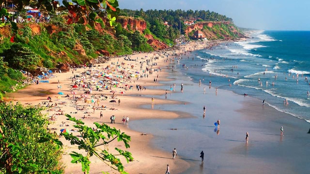 No 9. Varkala: This coastal town in the Thiruvananthapuram district is famous for its distinctive red laterite cliffs, adventure sports, and the Papanasam waters. Also known as the Papanasam Beach, the Varkala Beach offers a peaceful retreat. (Image: Shutterstock) No 9. Varkala: This coastal town in the Thiruvananthapuram district is famous for its distinctive red laterite cliffs, adventure sports, and the Papanasam waters. Also known as the Papanasam Beach, the Varkala Beach offers a peaceful retreat. (Image: Shutterstock)