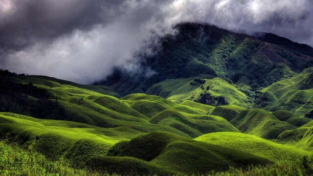 No 11. Dzukou Valley, Nagaland | Nestled in the hills of Nagaland, Dzükou Valley is a pristine natural wonder with verdant landscapes and seasonal flowers. December is the ideal time for trekkers to explore its untouched beauty, enjoy peaceful solitude, and witness the valley’s peaceful ambiance.