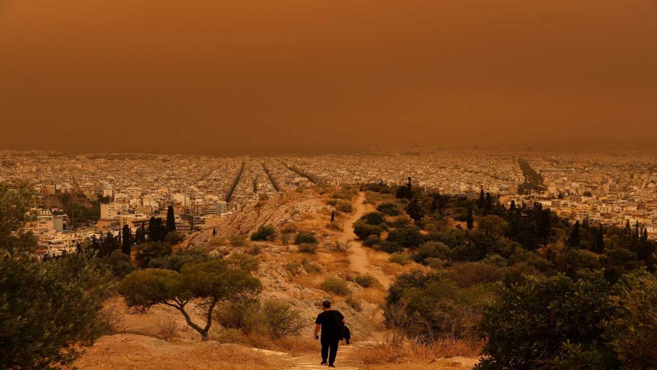 2. Orange skies in Greece | On Tuesday, strong winds carrying dust from the Sahara Desert turned sky apocalyptic "orange" over major Greek cities, including Athens. This happened after days of strong winds from the south. The haze limited visibility in the region, prompting warnings from the authorities of breathing risks. Earlier, Greece was struck by Sahara dust clouds in late March and early April. It also smothered parts of Switzerland and the southern cities of France.