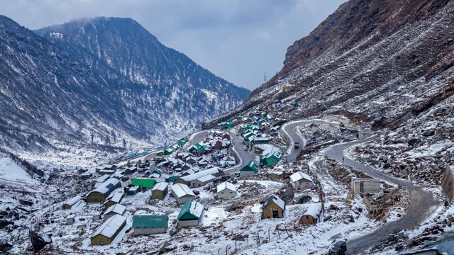 No 8. Lachung, Sikkim |  When to travel:  November to February | Best time to Book: September | Based at an altitude of about 9600 ft above sea level, this popular mountain village in Sikkim is known for its natural beauty. Here you get to see panoramic views and snow-covered landscapes, besides multiple adventurous activities. This place is surrounded by lush green valleys as well as sparkling waterfalls. Often, people call this place the nature lover's paradise. The weather in Lachung remains quite pleasant between March and May as it's the ideal time for sightseeing. However, if you are a snowfall lover, then do come here during the winter season. (image: )