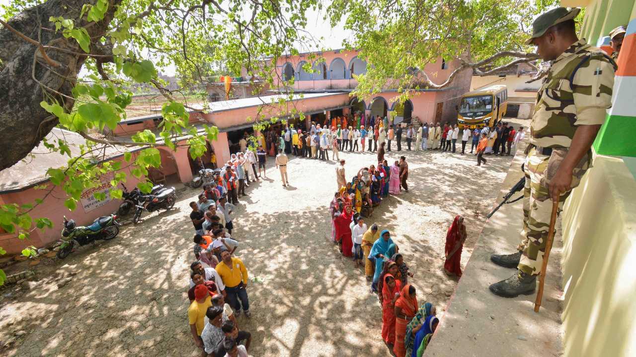 Voters wait to cast their votes for Lok Sabha elections, in Aurangabad. (PTI)