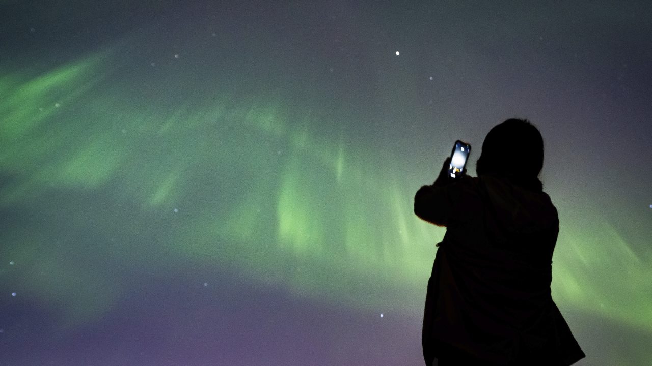 In the US, the intense solar storm displayed an astonishing light show in the sky last night, with sightings of the northern lights as far south as Fort Lauderdale, Florida. (Image: AP)