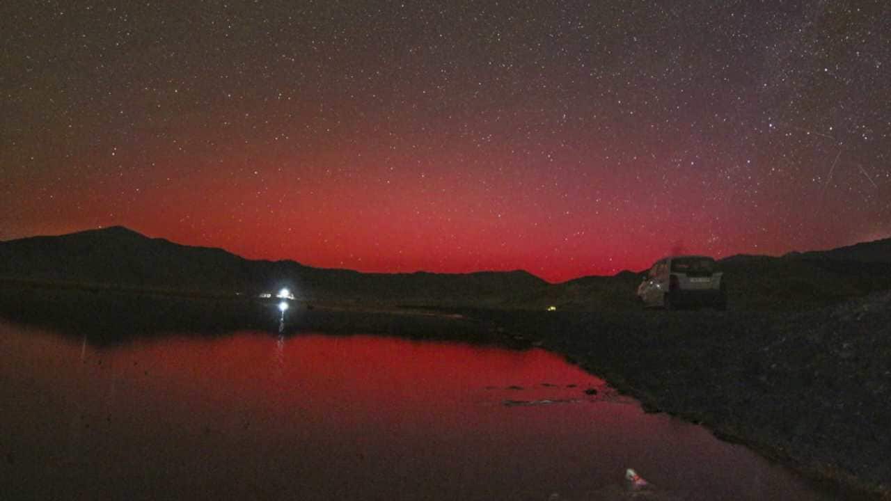 A crimson glow lit up the dark sky in parts of Ladakh in a rare stable auroral red arc event at the Hanle Dark Sky Reserve in the high Himalayas due to the strong solar magnetic storms launched towards Earth. The solar storms or coronal mass ejections are from the AR13664 region of the sun that has produced several high energy solar flares, some of which are travelling towards Earth at a speed of 800 km/s, scientists at the Centre of Excellence in Space Sciences in India (CESSI), Kolkata, said. (Image: PTI)