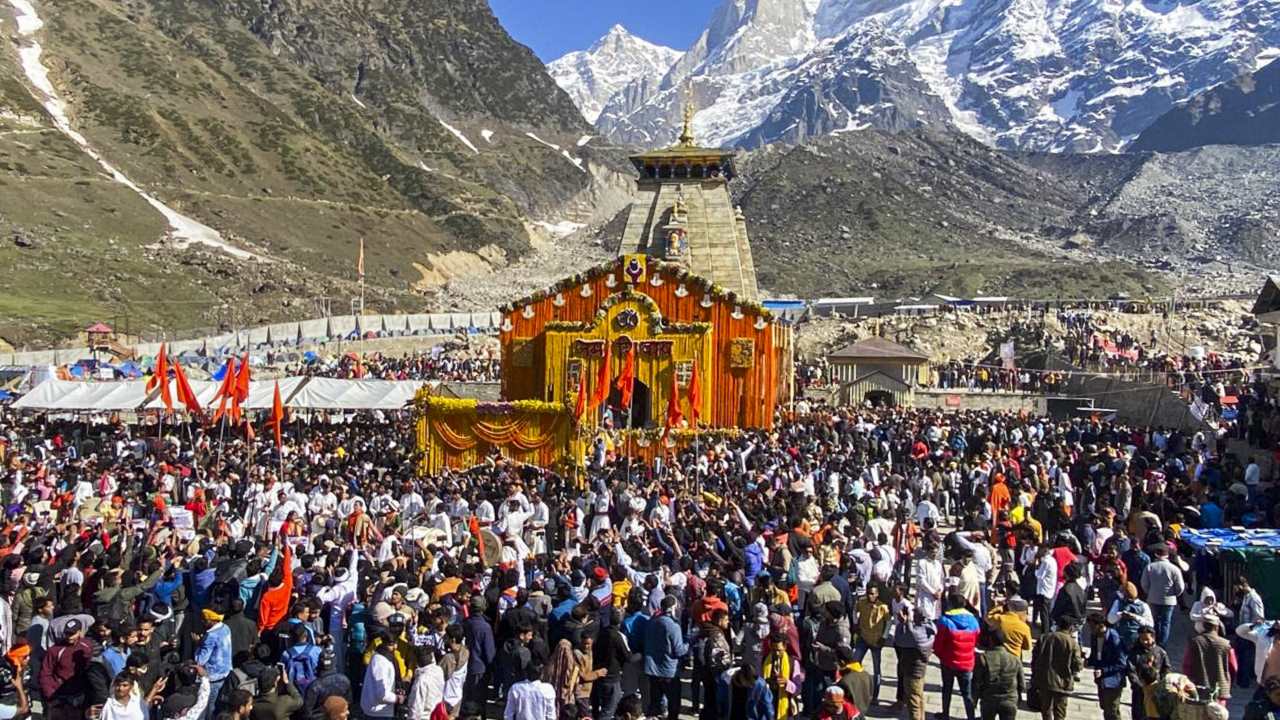 The doors of the revered Himalayan temples dedicated to Lord Shiva and Goddess Yamunotri were opened at 7 am in the presence of a hundreds of devotees who were chanting hymns. Uttarakhand Chief Minister Pushkar Singh Dhami along with his wife Geeta were present as the doors of Kedartnath temple opened for devotees. (Image: PTI)
