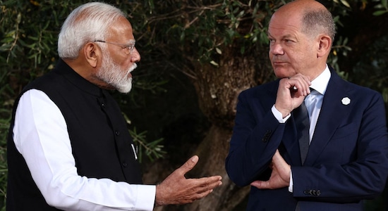 PM Modi speaks with German Chancellor Olaf Scholz at the G7 summit at the Borgo Egnazia resort, in Savelletri, Italy on June 14/Reuters