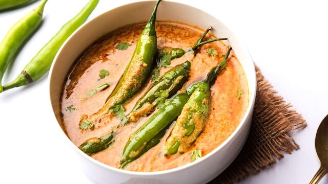 4. Mirchi ka Salan | Mirchi ka Salan is a tangy and spicy curry made with large green chillies simmered in a peanut, sesame, and tamarind-based gravy. It is traditionally served as a side dish with biryani, adding a unique depth of flavour. Despite its fiery appearance, the dish is more flavourful than extremely spicy.