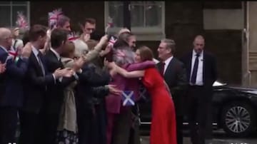 Starmer and wife in front in 10 Downing Street. Starmer and wife in front in 10 Downing Street.