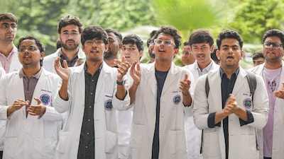 Medical students stage a protest against the sexual assault and murder of a postgraduate trainee doctor in Kolkata, at Ram Manohar Lohia Hospital, in New Delhi, Monday, Aug. 12, 2024. (PTI Photo/Shahbaz Khan)