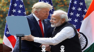 U.S. President Donald Trump and India's Prime Minister Narendra Modi embrace during a joint news conference after bilateral talks at Hyderabad House in New Delhi, India, February 25, 2020. REUTERS/Adnan Abidi