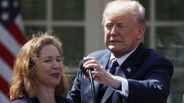 U.S. President Donald Trump adjusts the mic for Nicole Bergstrom of Smithcraft Signs of Avondale, Arizona while delivering remarks on tax cuts for American workers during an event in the White House Rose Garden in Washington, U.S., April 12, 2018. REUTERS/Kevin Lamarque U.S. President Donald Trump adjusts the mic for Nicole Bergstrom of Smithcraft Signs of Avondale, Arizona while delivering remarks on tax cuts for American workers during an event in the White House Rose Garden in Washington, U.S., April 12, 2018. REUTERS/Kevin Lamarque