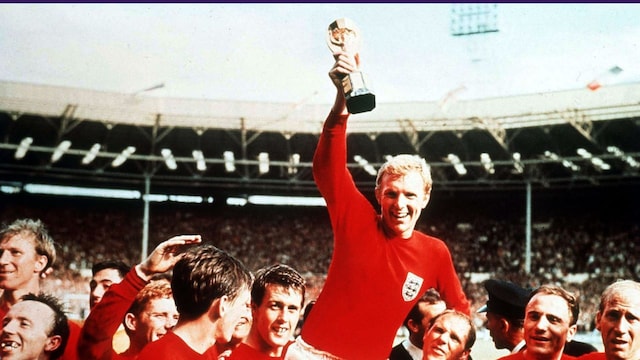 This is the most iconic image of the 1966 World Cup. Pictured: England captain Bobby Moore holds the Jules Rimet trophy aloft on the shoulders of his teammates. 