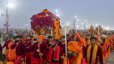 Prayagraj: 'Sadhus' arrive to take a holy dip at Sangam on the occasion of 'Makar Sankranti' during the Maha Kumbh Mela 2025, in Prayagraj, Uttar Pradesh, Tuesday, Jan. 14, 2025. (PTI Photo)(PTI01_14_2025_000379A)