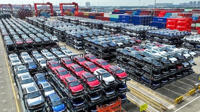 (FILES) In this photo taken on September 11, 2023, BYD electric cars wait to be loaded on a ship are stacked at the international container terminal of Taicang Port at Suzhou Port, in Chinaís eastern Jiangsu Province. Shares in Chinese automaker BYD jumped on February 11, 2025 after it unveiled plans to unroll advanced self-driving technology on nearly all its cars, including budget models priced below 10,000 USD. (Photo by AFP) / China OUT / CHINA OUT / CHINA OUT