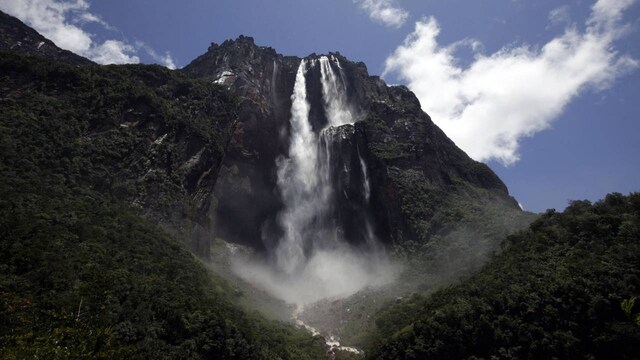 Angel Falls, Venezuela | Angel Falls, the world's tallest uninterrupted waterfall, is a breathtaking sight and a magnet for base jumpers. The 979-meter drop is an exciting experience, but the dense jungle and unpredictable weather conditions add to the hazards. Climbers and base jumpers must be prepared for the challenges posed by this environment.