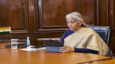 **EDS: THIRD PARTY IMAGE** In this image via @FinMinIndia on X on Jan. 31, 2025, Union Finance Minister Nirmala Sitharaman gives final touches to the Union Budget 2025-26 at her office in North Block, in New Delhi. (@FinMinIndia via PTI Photo)(PTI01_31_2025_000421B)