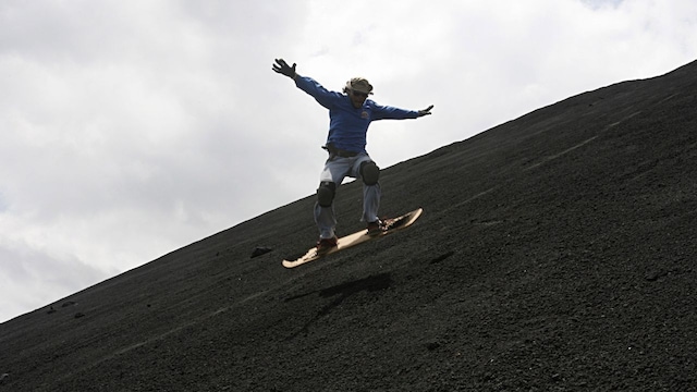 Cerro Negro, Nicaragua | Cerro Negro, an active volcano, is a popular destination for volcano boarding. Participants slide down the ash-covered slopes at high speeds, but the risks are significant. Falls, cuts from volcanic ash, and potential eruptions are all hazards that participants must contend with. Protective gear is critical for safety here.