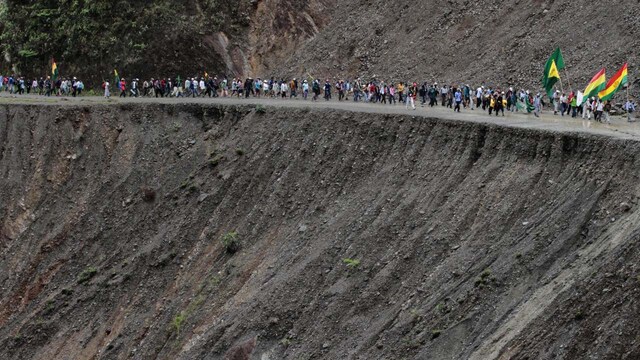 Death Road, Bolivia | The Yungas Road, infamously known as Death Road, is a 69 km stretch of treacherous terrain that attracts extreme bikers. Cyclists must navigate narrow paths with steep drop-offs, fog, rain, and landslides, making it a hazardous journey. Despite the risks, Death Road remains a popular destination for thrill-seekers.