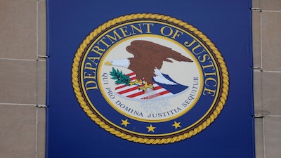FILE PHOTO: The crest of the United States Department of Justice (DOJ) is seen at their headquarters in Washington, D.C., U.S., May 10, 2021. REUTERS/Andrew Kelly/File Photo/File Photo