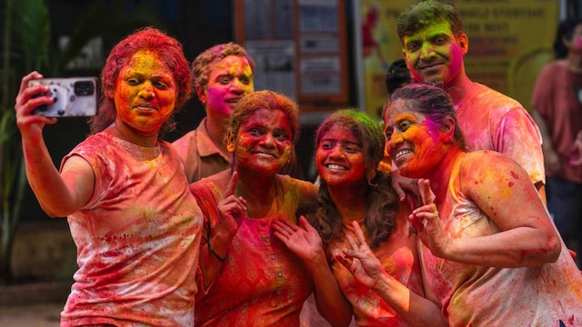 In some places, people hurled marigolds, roses and jasmine petals instead of colored powder. Amid massive celebrations in the west Indian city of Ahmedabad, thousands of people gathered at temple were sprayed with colored water from huge pipes as they swayed to traditional Gujarati music, clapping over their heads.