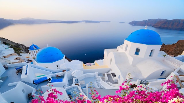 5) Santorini, Greece | Santorini’s whitewashed buildings and blue-domed churches make it a dream destination. Explore Oia’s narrow streets, relax on black-sand beaches or take a boat trip to the volcanic islands. Greek cuisine is one of the most-loved across the world. (Image: Shutterstock) 5) Santorini, Greece | Santorini’s whitewashed buildings and blue-domed churches make it a dream destination. Explore Oia’s narrow streets, relax on black-sand beaches or take a boat trip to the volcanic islands. Greek cuisine is one of the most-loved across the world. (Image: Shutterstock)