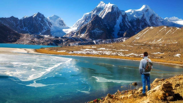 No 1. Gurudongmar Lake | Located at an elevation of 5,183 meters, the Gurudongmar Lake lies on the northern side of the Khangchengyao Range. The pristine lake sits amidst snow-secured mountains. It is situated just a few kilometers from the Tibetan and Chinese border. Barring one particular spot, the entire Gurudongmar Lake freezes up during the winter months. The best time to visit here is from March through June. (Image: Shutterstock) No 1. Gurudongmar Lake | Located at an elevation of 5,183 meters, the Gurudongmar Lake lies on the northern side of the Khangchengyao Range. The pristine lake sits amidst snow-secured mountains. It is situated just a few kilometers from the Tibetan and Chinese border. Barring one particular spot, the entire Gurudongmar Lake freezes up during the winter months. The best time to visit here is from March through June. (Image: Shutterstock)