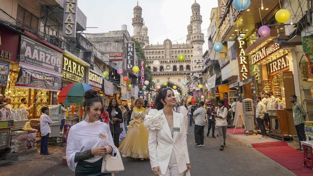 As part of a heritage walk, the contestants made their way to Laad Bazar for a curated shopping experience. The bustling market, famed for its bangles and pearl jewellery, showcased traditional craftsmanship through live demonstrations of bangle-making techniques. The Miss World delegates expressed admiration for the artisans’ skill and attention to detail. (Image: PTI) As part of a heritage walk, the contestants made their way to Laad Bazar for a curated shopping experience. The bustling market, famed for its bangles and pearl jewellery, showcased traditional craftsmanship through live demonstrations of bangle-making techniques. The Miss World delegates expressed admiration for the artisans’ skill and attention to detail. (Image: PTI)