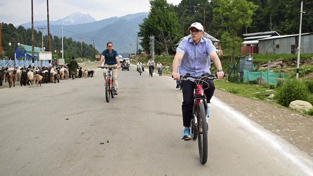 In a demonstration of resilience, Jammu and Kashmir Chief Minister Omar Abdullah cycled through the streets of Pahalgam on May 27, accompanied by his sons Zamir and Zahir. He engaged with locals, reassuring them about efforts to rejuvenate tourism swiftly. (Image: PTI) In a demonstration of resilience, Jammu and Kashmir Chief Minister Omar Abdullah cycled through the streets of Pahalgam on May 27, accompanied by his sons Zamir and Zahir. He engaged with locals, reassuring them about efforts to rejuvenate tourism swiftly. (Image: PTI)
