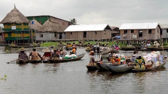 Ganvie, Africa: This village in Benin is set on stilts above the water, where all structures, including homes and markets, float over Lake Nokoué. The residents primarily engage in fishing and rely on tourism for their livelihoods. The journey from Cotonou to this unique village takes approximately four hours by boat. Established in the 16th and 17th centuries, it is now home to nearly 30,000 inhabitants. Ganvie, Africa: This village in Benin is set on stilts above the water, where all structures, including homes and markets, float over Lake Nokoué. The residents primarily engage in fishing and rely on tourism for their livelihoods. The journey from Cotonou to this unique village takes approximately four hours by boat. Established in the 16th and 17th centuries, it is now home to nearly 30,000 inhabitants.
