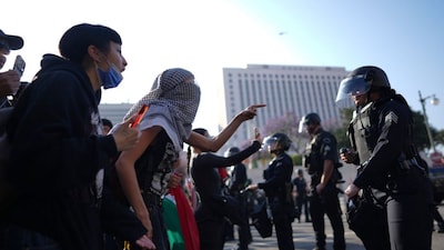 Immigration Raids Los Angeles
Protesters confront Los Angeles police department personnel in riot gear in downtown Los Angeles on Monday, June 9, 2025. (AP Photo/Eric Thayer)