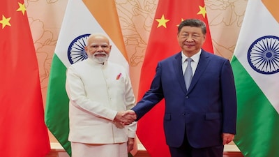 In this photo provided by Indian Prime Minister's Office, Indian Prime Minister Narendra Modi, left, and Chinese President Xi Jinping shake hand before their meeting on the sidelines of the Shanghai Cooperation Organization (SCO) summit in Tianjin, China Sunday, Aug. 31, 2025. (Indian Prime Minister's Office via AP)