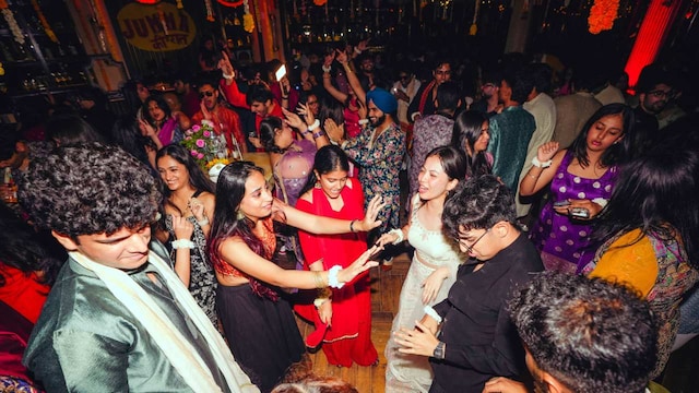People partying at a fake wedding event