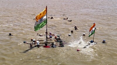 Patna: Swimmers hoist the national flag in the Ganga river on the occasion of the 79th Independence Day, in Patna, Bihar, Friday, Aug. 15, 2025. (PTI Photo) (PTI08_15_2025_000399A)