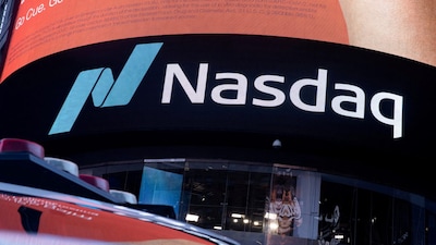FILE PHOTO: The Nasdaq logo is displayed at the Nasdaq Market site in Times Square in New York City, U.S., December 3, 2021. REUTERS/Jeenah Moon/File Photo/File Photo