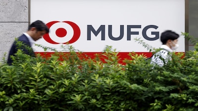 Signage for MUFG Bank Ltd., a unit of Mitsubishi UFJ Financial Group Inc. (MUFG), outside one of the bank's branches in Tokyo, Japan, on Tuesday, June 25, 2024. Japans financial regulator penalized MUFG's flagship banking unit and two joint ventures on Monday for violating client confidentiality rules, potentially dealing a further blow to their business. Photographer: Kiyoshi Ota/Bloomberg