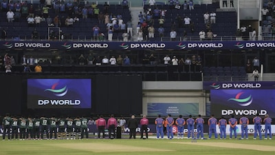 Players of team Pakistan, left, and team India, right, stand for their national anthems before the start of the Asia Cup cricket match between India and Pakistan at Dubai International Cricket Stadium in Dubai, United Arab Emirates, Sunday, Sept. 14, 2025. (AP Photo/Fatima Shbair)