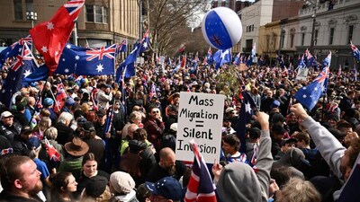 Protestors gather during the March for Australia anti-immigration rally in Melbourne, Sunday, Aug. 31, 2025. (Joel Carrett/AAP Image via AP)