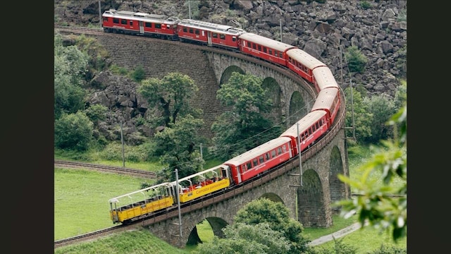 No 4. Bernina Express, Switzerland and Italy | One of the most scenic train journeys, this one passes through the Swiss Alps. It is known for its alpine scenery, glacial peaks, sparkling lakes and vibrant meadows. It runs between Chur or St. Moritz in Switzerland and Tirano in Italy. The train has modern coaches with large windows and comfortable seats, so you can relax and enjoy the amazing mountain views all the way. (Image: Reuters) No 4. Bernina Express, Switzerland and Italy | One of the most scenic train journeys, this one passes through the Swiss Alps. It is known for its alpine scenery, glacial peaks, sparkling lakes and vibrant meadows. It runs between Chur or St. Moritz in Switzerland and Tirano in Italy. The train has modern coaches with large windows and comfortable seats, so you can relax and enjoy the amazing mountain views all the way. (Image: Reuters)