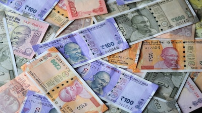 Rupee dips 10 paise to 90.15 vs USD; Fed, trade talks eyed