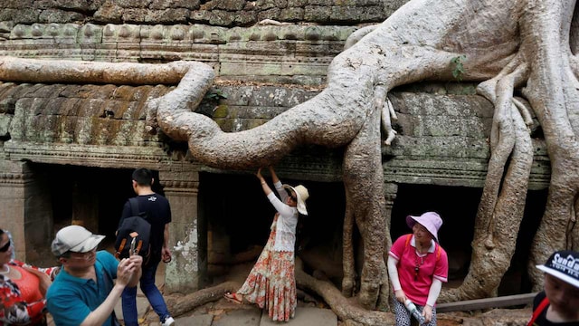 1. Ta Prohm, Cambodia | This 800-year-old temple in Angkor, is known as "Tomb Raider Temple" due to its Hollywood fame. Overrun by jungle, its stone walls are covered with enormous silk-cotton trees, whose roots crisscross hallways and doors. 1. Ta Prohm, Cambodia | This 800-year-old temple in Angkor, is known as "Tomb Raider Temple" due to its Hollywood fame. Overrun by jungle, its stone walls are covered with enormous silk-cotton trees, whose roots crisscross hallways and doors.